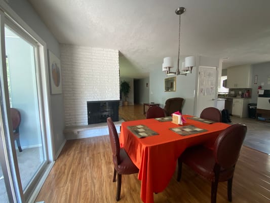 Bright, cozy common area with a dining table