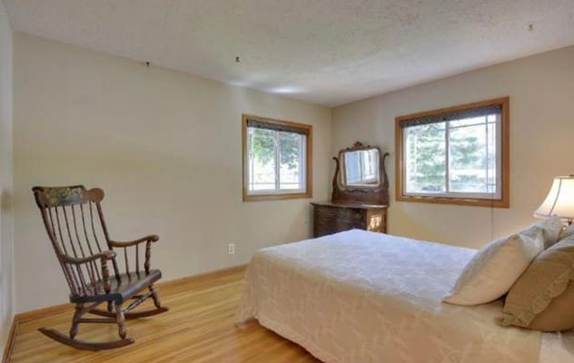Cozy private resident room with a wooden rocking chair