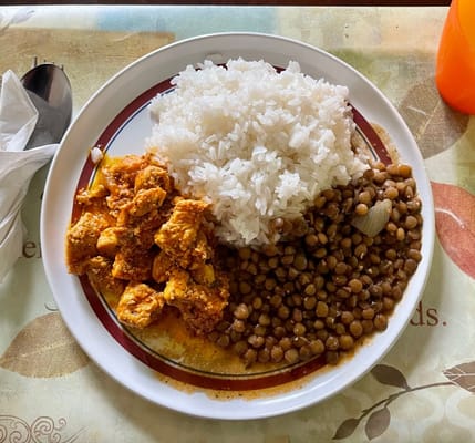 Plate of rice, chicken, and lentils served at La Familia Assisted Living