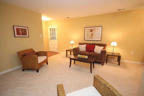 Spacious living room with comfortable seating and natural light