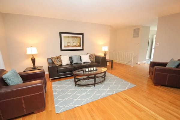 Living room with brown leather sofas and a coffee table