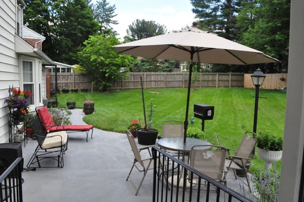 Outdoor patio area with seating and umbrellas