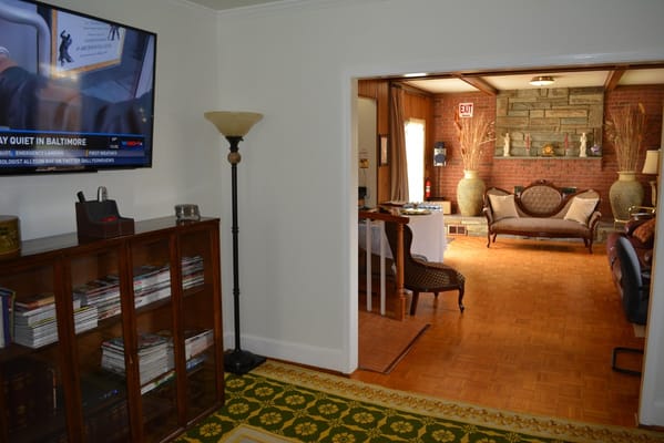Interior view of a common area with seating and TV
