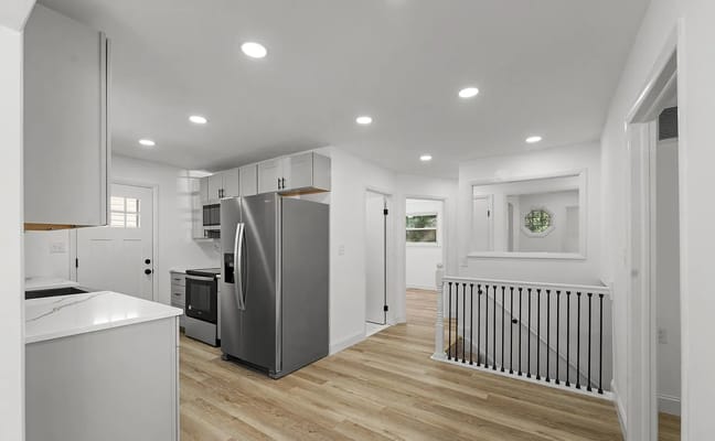 Modern kitchen with stainless steel appliances and bright interior