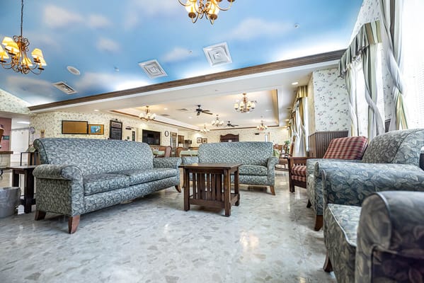 Cozy common area with sofas and decorative ceiling