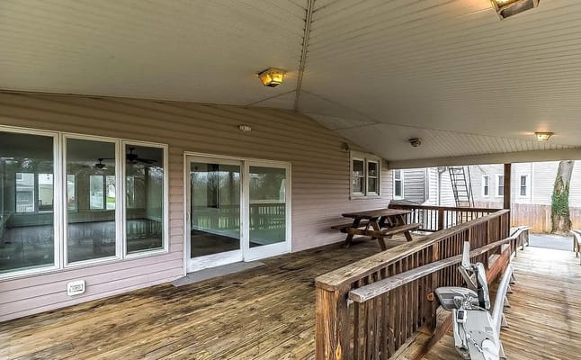Covered porch with picnic tables and access to the outdoors