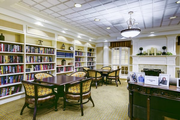 Interior view of a library with bookshelves and seating