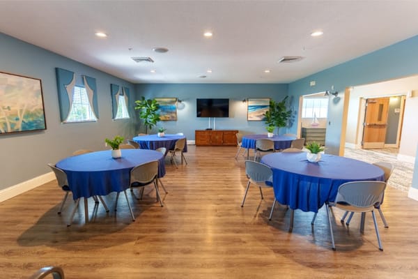 Interior common area with tables and blue tablecloths