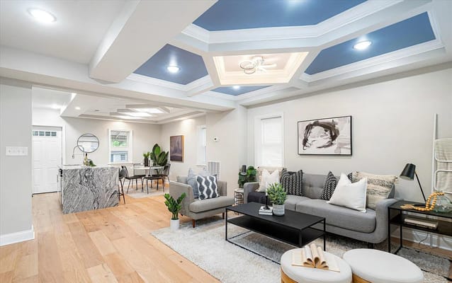 Modern living room with sofa, coffee table, and dining area