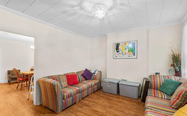 Bright common area with colorful couches and artwork