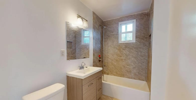Stylish bathroom with a shower and sink.