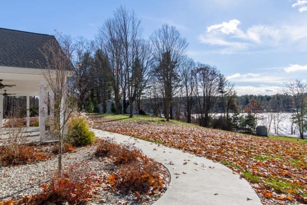 Pathway through outdoor space with vibrant fall foliage