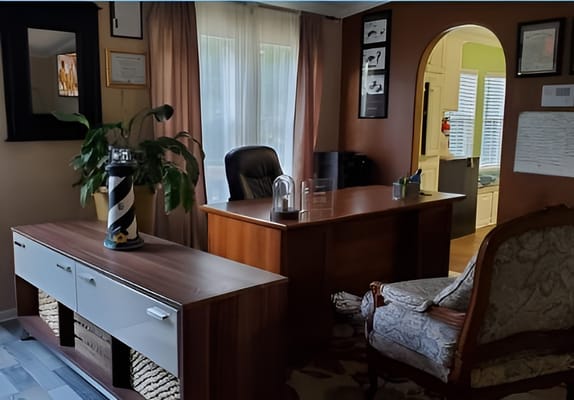 Cozy office reception area with desk and seating