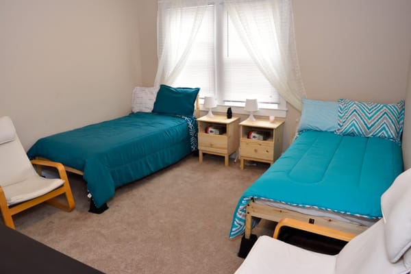 Cozy interior of a shared resident room with beds