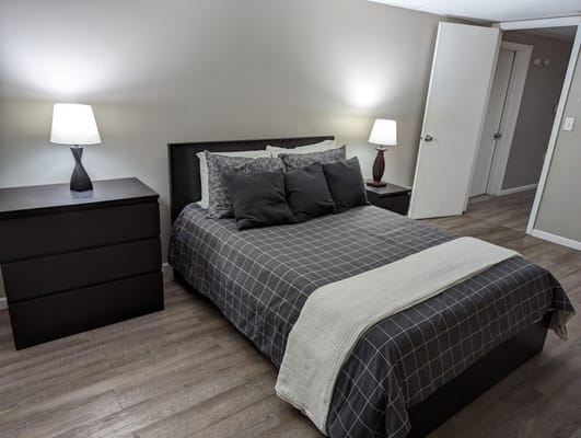 Cozy resident room with a bed and dresser