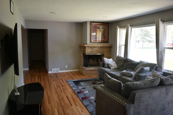 Spacious living room with a fireplace and comfortable seating