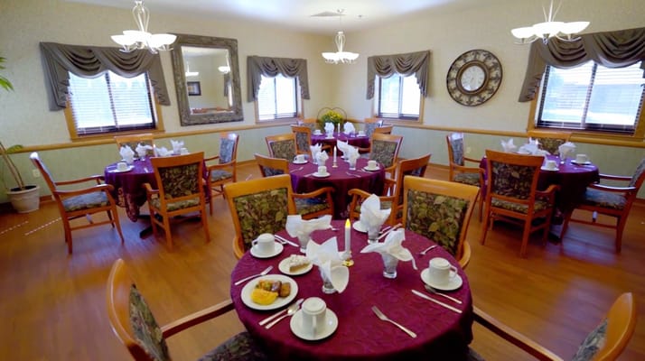 Elegant dining room with tables set for meals