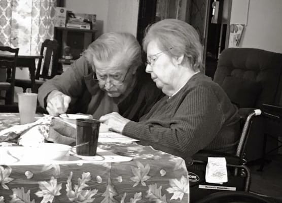 Residents engaged in a shared activity at a table