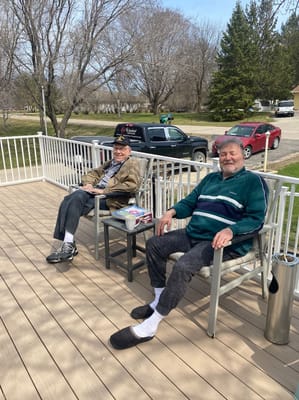 Two residents enjoying the outdoor patio