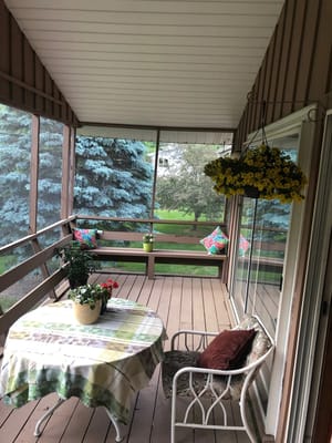 Outdoor patio area with flowers and seating