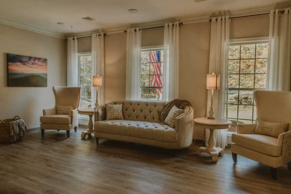 Bright interior common area with a cozy couch