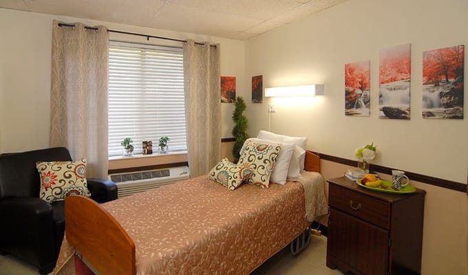 Cozy resident room with bed and seating area