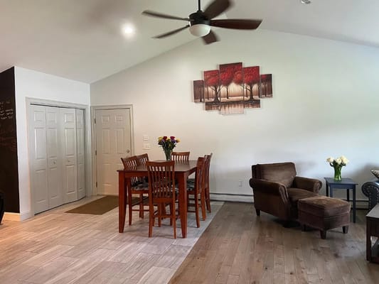 Interior view of dining area with wooden table and chairs in South Street facility.