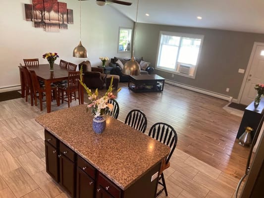 Spacious common area with dining table and lounge seating