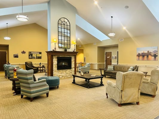 Interior common area with seating and a fireplace