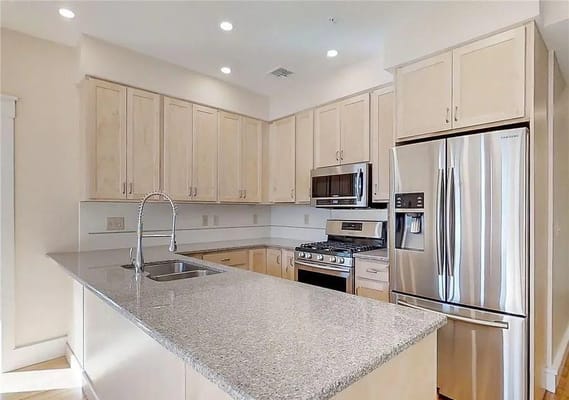 Modern kitchen with stainless steel appliances