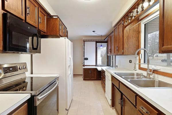 Spacious kitchen featuring wooden cabinets and modern appliances