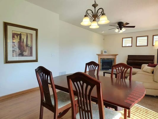Dining area with wooden table and chairs