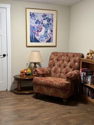 Cozy interior seating area with a vintage armchair and decor