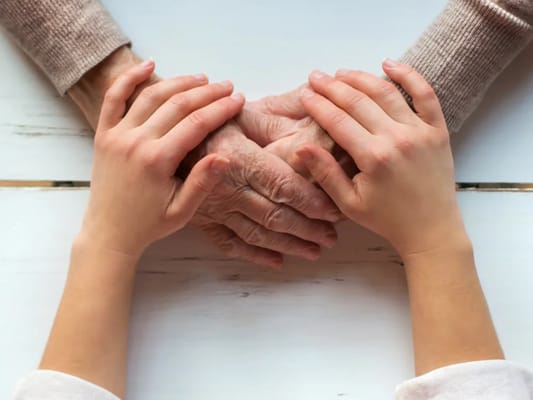 Close-up of hands representing connection between generations