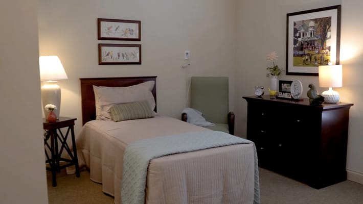 Cozy resident room with a bed and furniture