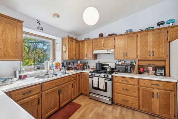 View of a cozy kitchen with oak cabinets and modern appliances