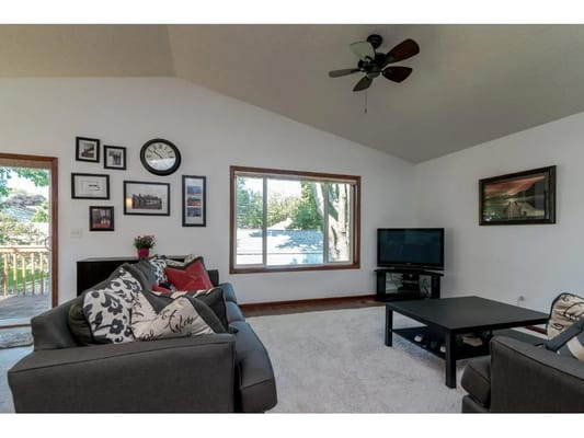 Cozy living room with couches and a TV