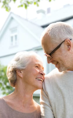 A couple sharing a joyful moment outdoors
