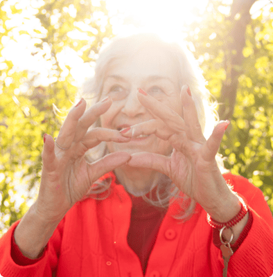 Resident enjoying nature with hands raised