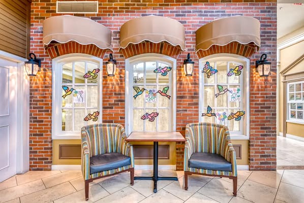 Bright sitting area with colorful stained glass windows