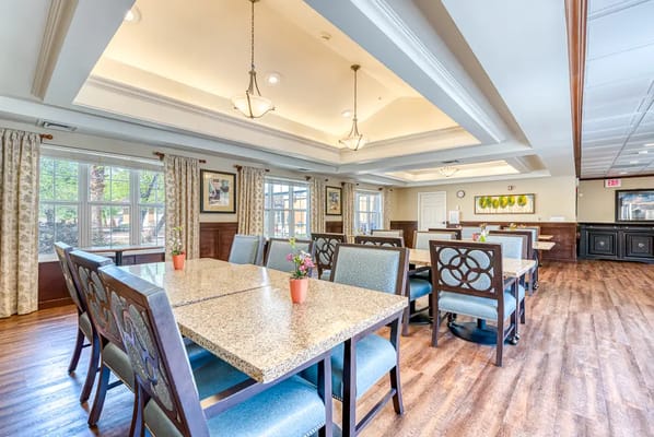Bright dining room with tables and chairs