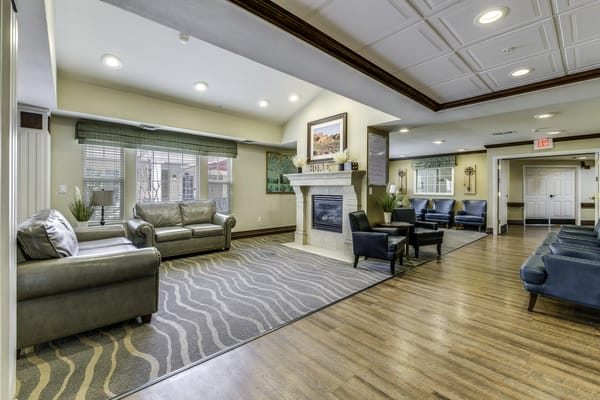 Common area with seating and fireplace in an interior space