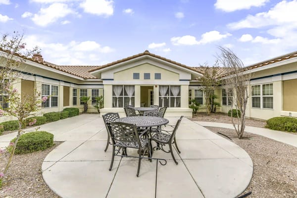 Outdoor patio area with seating and landscaping