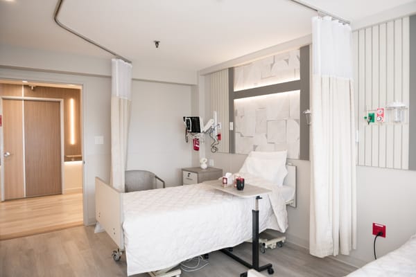 Brightly designed resident room with a bed and furnishings