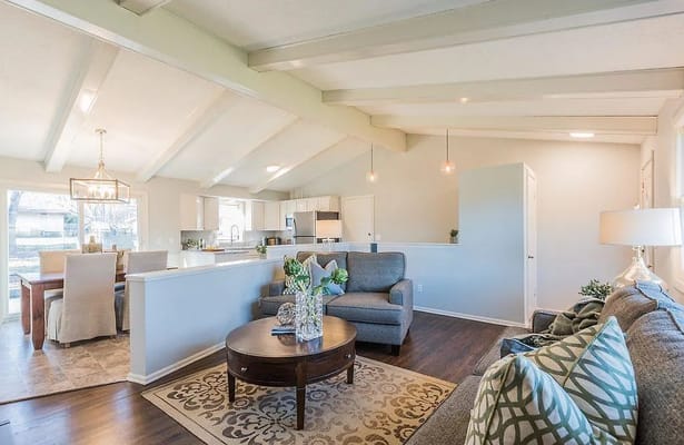 Cozy living room with modern decor and dining area