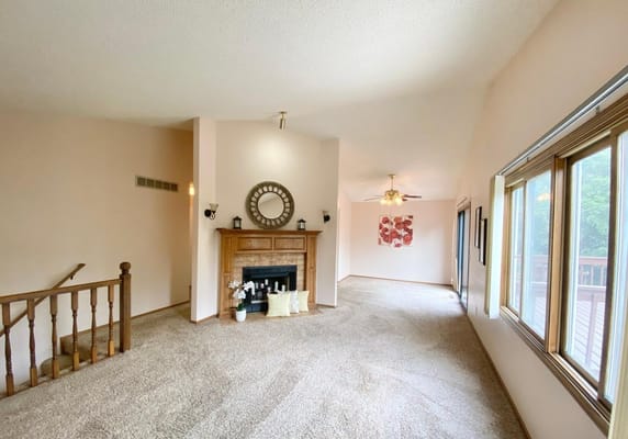 Spacious living room with a fireplace and large windows
