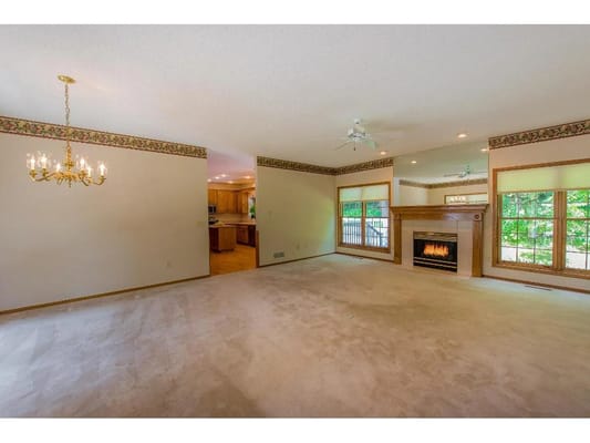 Spacious living room with a fireplace and large windows