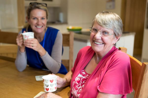 Residents enjoying tea in a common area