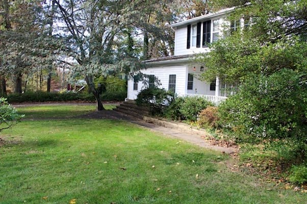 Exterior view of a senior living facility with garden