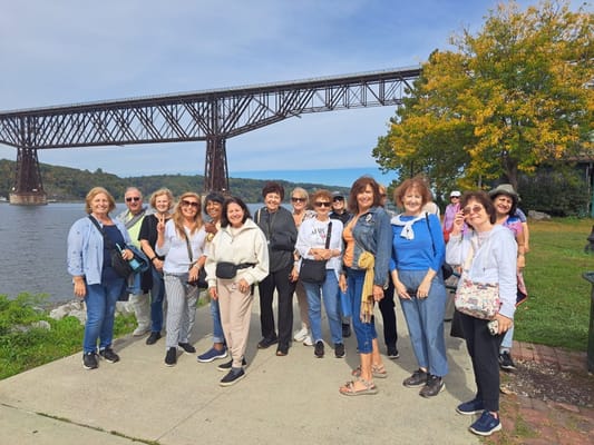 Group of residents enjoying a day outdoors by the river